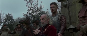 Movie still from “The Messenger: The Story of Joan of Arc” (1999), directed by Luc Besson – A group of people standing next to each other; Medium shot, Low angle