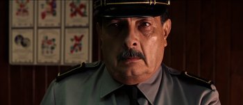 Movie still from “The Mexican” (2001), directed by Gore Verbinski – A person wearing a uniform; Close Up shot, Low angle