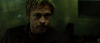 Movie still from “The Mexican” (2001), directed by Gore Verbinski – A person wearing a black jacket; Close Up shot, Low angle