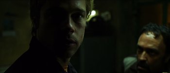 Movie still from “The Mexican” (2001), directed by Gore Verbinski – A person in a dark room; Close Up shot, Low angle