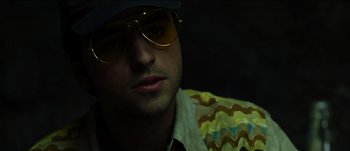 Movie still from “The Mexican” (2001), directed by Gore Verbinski – A person wearing a hat and sunglasses; Close Up shot, Low angle
