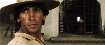 Movie still from “The Mexican” (2001), directed by Gore Verbinski – A person wearing a hat; Close Up shot, Low angle