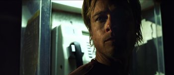 Movie still from “The Mexican” (2001), directed by Gore Verbinski – A man's face in a dark room; Close Up shot, Low angle