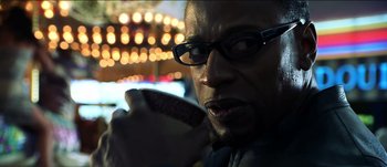 Movie still from “The Mexican” (2001), directed by Gore Verbinski – A person holding a piece of food; Close Up shot, Low angle