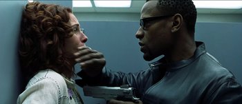 Movie still from “The Mexican” (2001), directed by Gore Verbinski – A man holding a gun up to a woman's face; Close Up shot, Over the shoulder angle