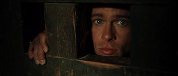 Movie still from “The Mexican” (2001), directed by Gore Verbinski – A person looking through a hole; Close Up shot, Overhead angle