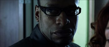 Movie still from “The Mexican” (2001), directed by Gore Verbinski – A person wearing glasses; Extreme Close Up shot, Low angle