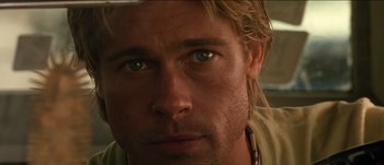 Movie still from “The Mexican” (2001), directed by Gore Verbinski – A man's face with blue eyes and blonde hair; Close Up shot, Over the shoulder angle