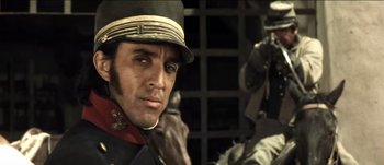 Movie still from “The Mexican” (2001), directed by Gore Verbinski – A person wearing a hat; Close Up shot, Low angle