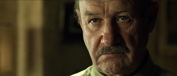 Movie still from “The Mexican” (2001), directed by Gore Verbinski – An older man with a mustache and a mustache comb; Close Up shot, Low angle