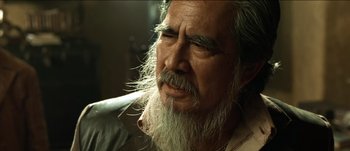 Movie still from “The Mexican” (2001), directed by Gore Verbinski – An old man with a long white beard; Close Up shot, Low angle