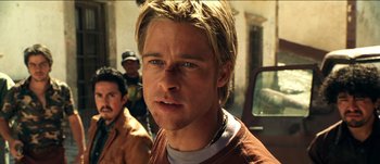 Movie still from “The Mexican” (2001), directed by Gore Verbinski – A man with long blonde hair and a beard; Close Up shot, Low angle