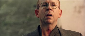 Movie still from “The Mexican” (2001), directed by Gore Verbinski – A person wearing glasses; Close Up shot, Low angle