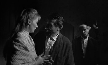 Movie still from “The Miracle Worker” (1962), directed by Arthur Penn – A man and a woman talking to another man; Medium shot, Over the shoulder angle
