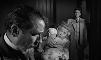 Movie still from “The Miracle Worker” (1962), directed by Arthur Penn – An old man and a woman in a room with a man in a suit; Close Up shot, Over the shoulder angle