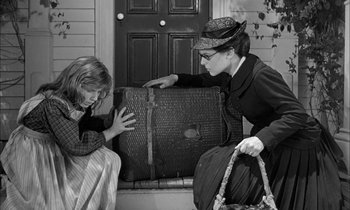 Movie still from “The Miracle Worker” (1962), directed by Arthur Penn – Two women are sitting next to each other; Medium shot, Over the shoulder angle