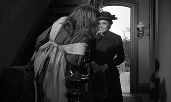 Movie still from “The Miracle Worker” (1962), directed by Arthur Penn – An old woman standing in front of a woman in an old dress; Medium shot, Over the shoulder angle