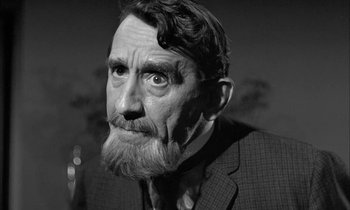 Movie still from “The Miracle Worker” (1962), directed by Arthur Penn – An old man with a beard and a mustache; Close Up shot, Over the shoulder angle