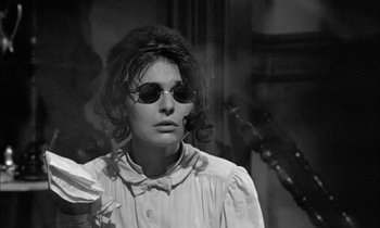 Movie still from “The Miracle Worker” (1962), directed by Arthur Penn – A black and white photo of a woman wearing sunglasses; Close Up shot, Low angle