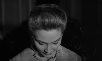 Movie still from “The Miracle Worker” (1962), directed by Arthur Penn – A black and white photo of a woman's face; Close Up shot, High angle