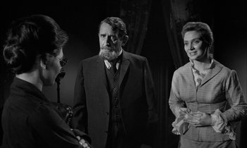 Movie still from “The Miracle Worker” (1962), directed by Arthur Penn – Two women and a man in a suit and tie; Medium shot, Over the shoulder angle
