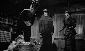 Movie still from “The Miracle Worker” (1962), directed by Arthur Penn – A group of people standing next to each other in a room; Medium shot, Low angle