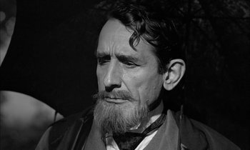 Movie still from “The Miracle Worker” (1962), directed by Arthur Penn – An old man with a beard and a long mustache; Close Up shot, Low angle