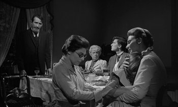 Movie still from “The Miracle Worker” (1962), directed by Arthur Penn – A group of people sitting around a table; Medium shot, Over the shoulder angle
