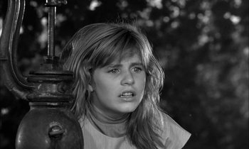 Movie still from “The Miracle Worker” (1962), directed by Arthur Penn – A woman with long blonde hair is looking to her left; Close Up shot, Low angle