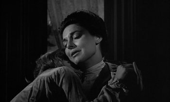 Movie still from “The Miracle Worker” (1962), directed by Arthur Penn – An old photo of a woman hugging a child; Close Up shot, Low angle