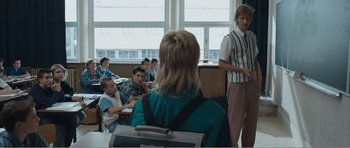 Movie still from “The Misfortunates” (2009), directed by Felix van Groeningen – A group of people sitting in a room; Medium shot, Over the shoulder angle