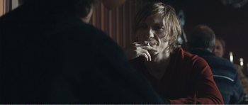 Movie still from “The Misfortunates” (2009), directed by Felix van Groeningen – A man smoking a cigarette in front of a mirror; Close Up shot, Over the shoulder angle