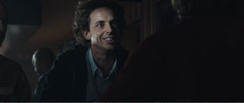 Movie still from “The Misfortunates” (2009), directed by Felix van Groeningen – A person sitting at a table; Close Up shot, Over the shoulder angle