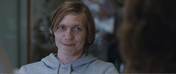 Movie still from “The Misfortunates” (2009), directed by Felix van Groeningen – A person wearing a hoodie; Close Up shot, Over the shoulder angle