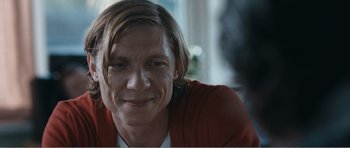 Movie still from “The Misfortunates” (2009), directed by Felix van Groeningen – A person smiling for a picture; Close Up shot, Over the shoulder angle