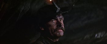 Movie still from “The Molly Maguires” (1970), directed by Martin Ritt – A person wearing a hat; Close Up shot, Low angle