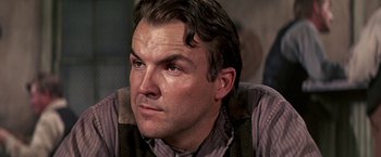 Movie still from “The Molly Maguires” (1970), directed by Martin Ritt – A person wearing a shirt and vest; Close Up shot, Low angle