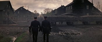 Movie still from “The Molly Maguires” (1970), directed by Martin Ritt – A couple of men walking down a dirt road; Wide shot, High angle