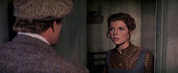 Movie still from “The Molly Maguires” (1970), directed by Martin Ritt – A man and a woman looking at each other in front of a mirror; Close Up shot, Over the shoulder angle