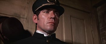 Movie still from “The Molly Maguires” (1970), directed by Martin Ritt – A person wearing a uniform; Close Up shot, Low angle