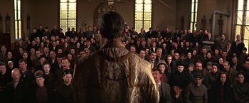 Movie still from “The Molly Maguires” (1970), directed by Martin Ritt – A crowd of people are gathered in a room; Wide shot, High angle