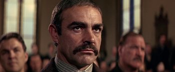 Movie still from “The Molly Maguires” (1970), directed by Martin Ritt – A person with a mustache; Close Up shot, Low angle