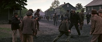 Movie still from “The Molly Maguires” (1970), directed by Martin Ritt – A group of men playing a game of baseball in the dirt; Wide shot, High angle