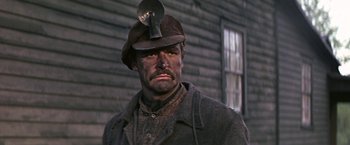 Movie still from “The Molly Maguires” (1970), directed by Martin Ritt – A person wearing a hat; Close Up shot, Low angle