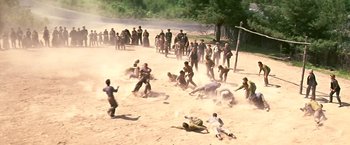 Movie still from “The Molly Maguires” (1970), directed by Martin Ritt – A group of people on a beach playing baseball; Extreme Wide shot, High angle