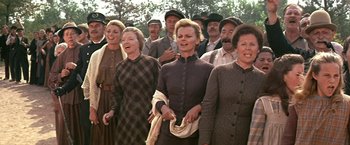 Movie still from “The Molly Maguires” (1970), directed by Martin Ritt – A group of people standing next to each other; Medium shot, Low angle