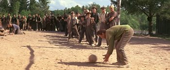 Movie still from “The Molly Maguires” (1970), directed by Martin Ritt – A group of people in a field with a soccer ball; Wide shot, High angle