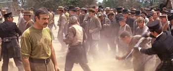 Movie still from “The Molly Maguires” (1970), directed by Martin Ritt – A group of men walking on a dirt road; Medium shot, Low angle