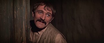 Movie still from “The Molly Maguires” (1970), directed by Martin Ritt – A person with a mustache; Close Up shot, Over the shoulder angle