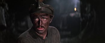 Movie still from “The Molly Maguires” (1970), directed by Martin Ritt – A man with a hat on his head and face; Close Up shot, High angle